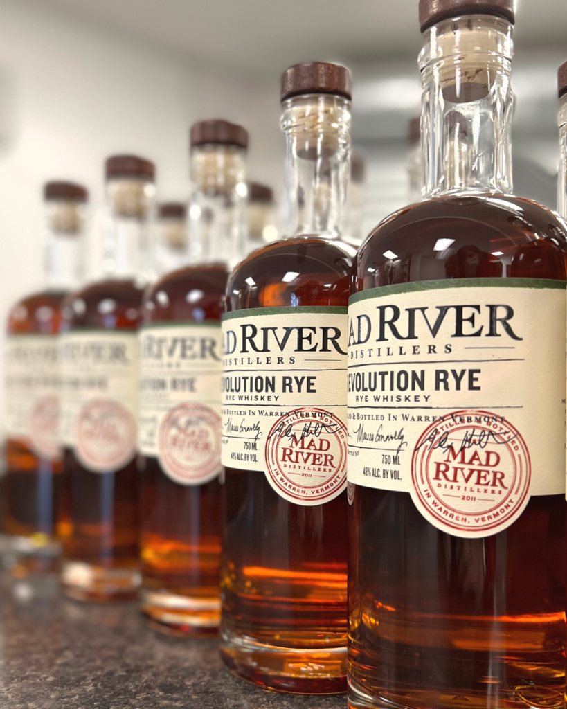 Lineup of Mad River Distillers Revolution Rye bottles.