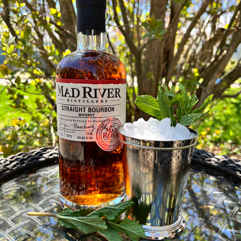 Mad River Distillers Straight Bourbon and a julep cup filled with ice and mint on a table