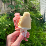 hand holding two rum popsicles