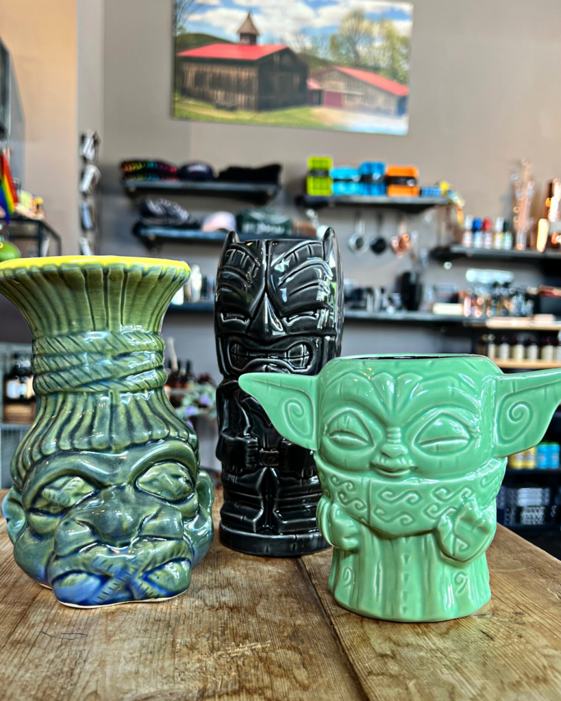 A few Tiki mugs on a table at Mad River Distillers