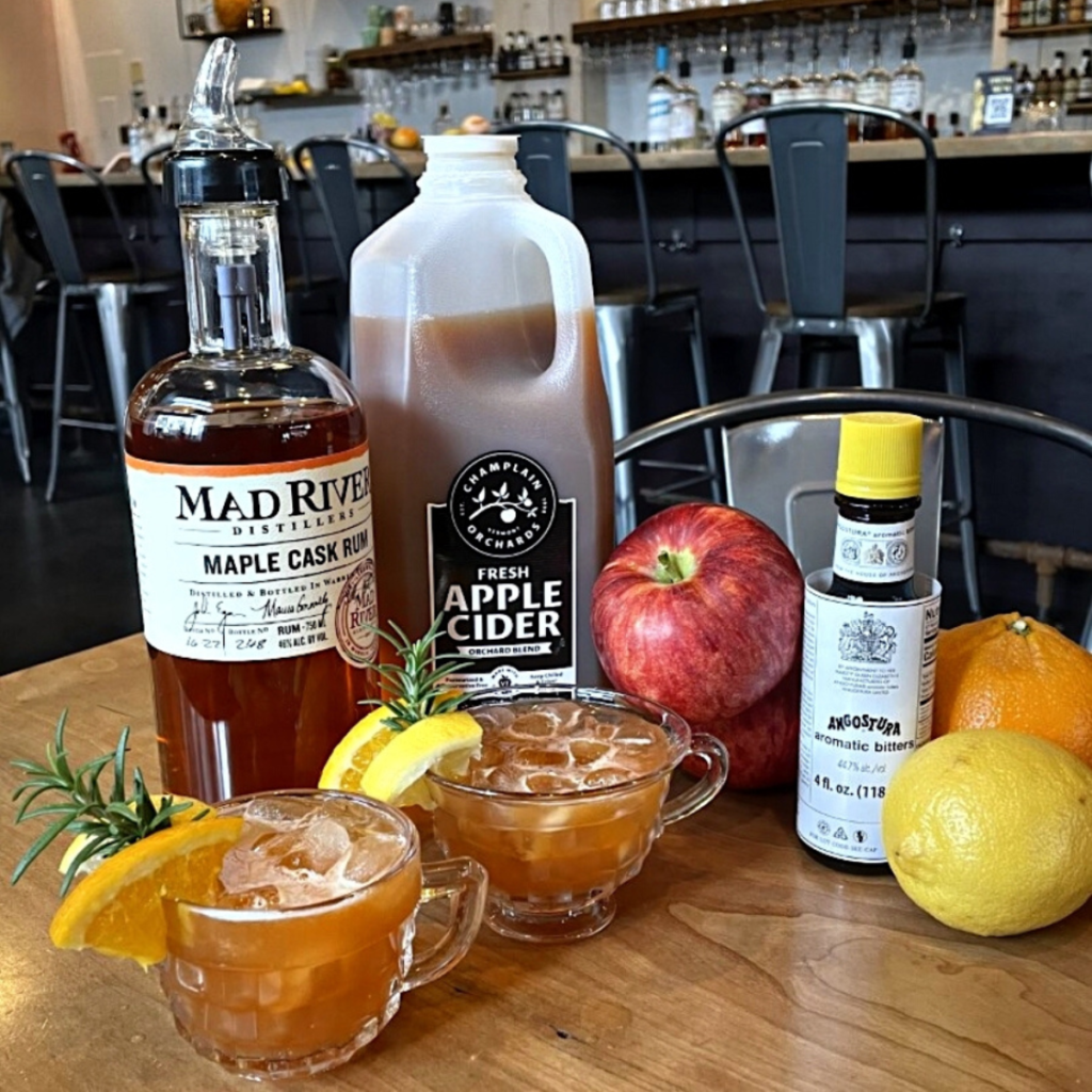 Cider Punch cocktail and ingredients on a table