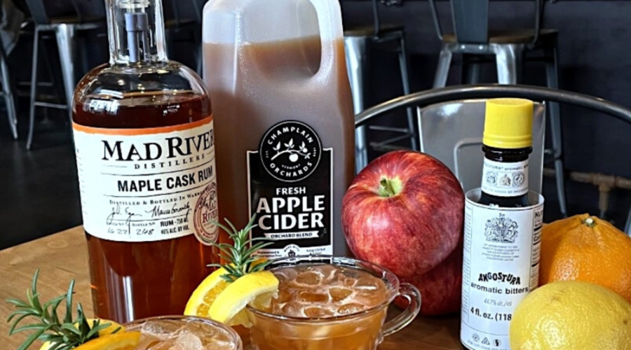 Cider Punch cocktail and ingredients on a table