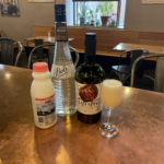 Brandy Alexander cocktail and ingredients on a table