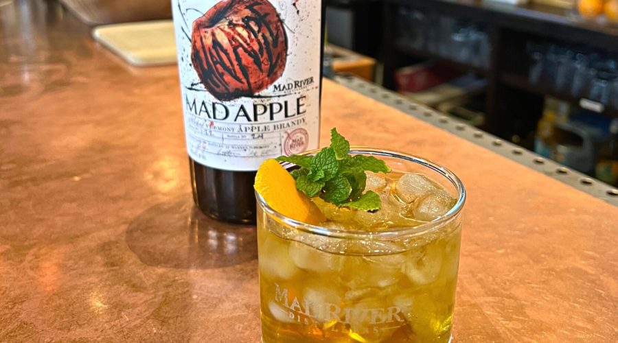 Mad River Stinger on the tasting room bar with a bottle of Mad Apple Brandy
