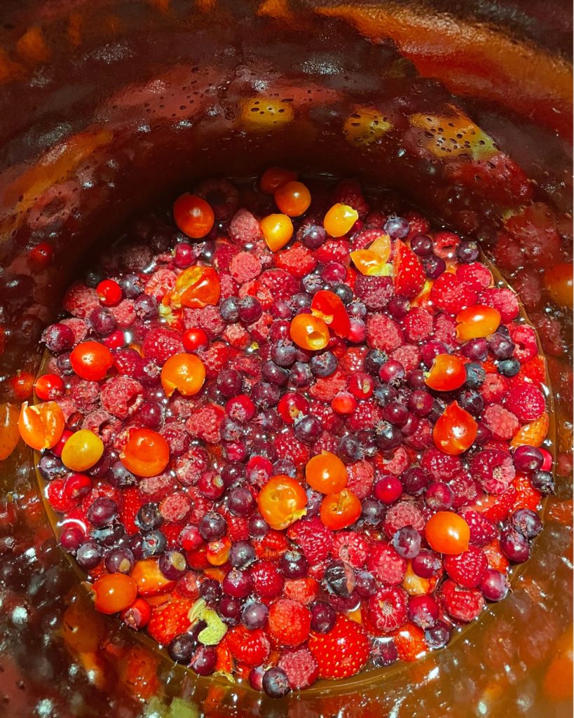 Mixed berries in a Rumtopf pot